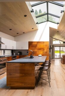 A special finish brings out the grain in the kitchen's walnut cabinetry.