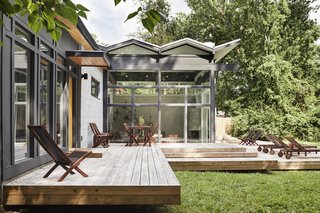 An energy-efficient TPO membrane covers the living room’s zigzag roof.