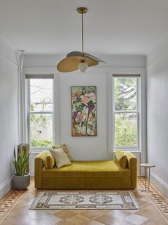In a guest bedroom, the “Olivia” pendant from West Elm.