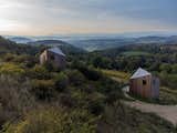 Two Tiny Cabins Perched on Plinths Take In Valley Views in Poland