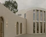Curves and a Courtyard Transport This Australian Weatherboard Cottage From Its Suburban Setting