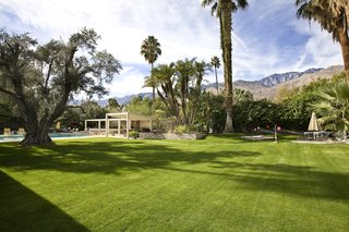 The expansive grassy lawns features several ponds, fountains, native greenery, and even a tea house.