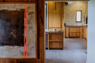 The kitchen flooring is 24” x 24” DalTile Chadwick Charcoal Tile and the wall tile is by Heath Ceramics.