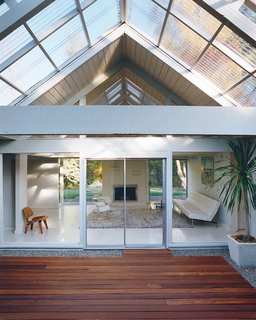 The literal and figurative centerpiece of the house is the atrium, through which light filters into the rest of the house year-round.